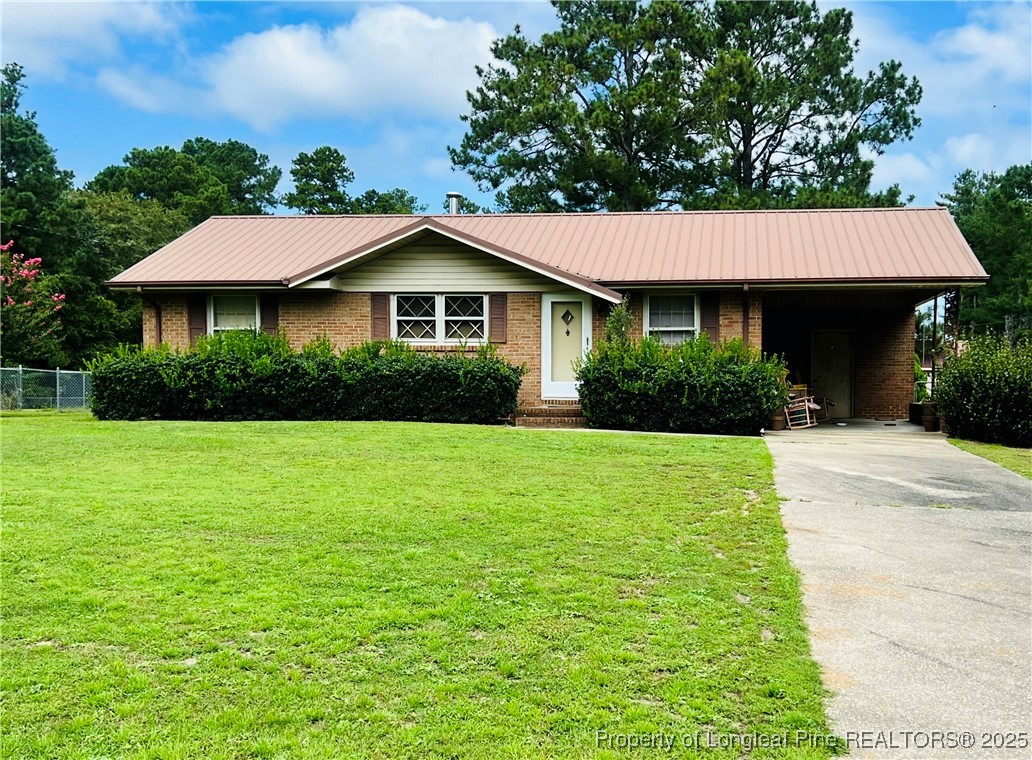a view of a house with garden and yard