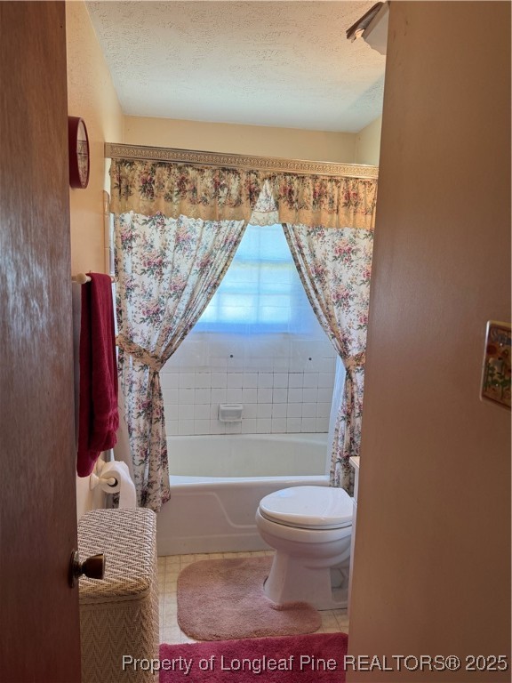 10981 Academy Road Laurinburg, NC 28352 - Photo 5 of 8 a bathroom with a toilet and a shower