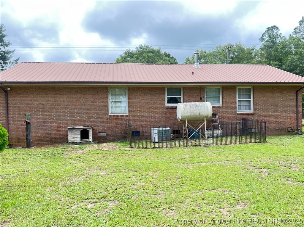 10981 Academy Road Laurinburg, NC 28352 - Photo 8 of 8 a view of a house with a yard and sitting area