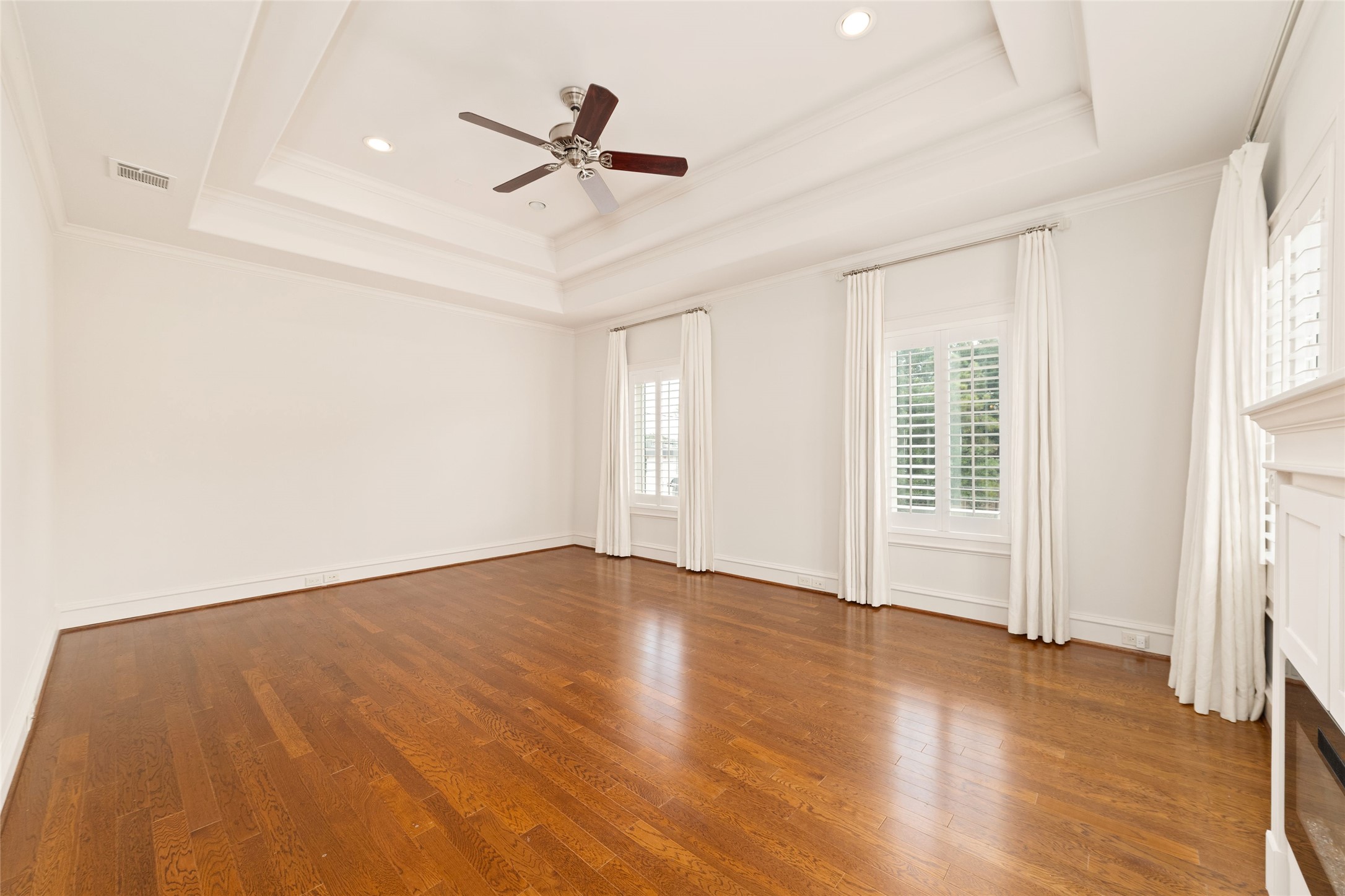 4102 Gramercy Street Houston, TX 77025 - Photo 18 of 35 a view of empty room with wooden floor and fan