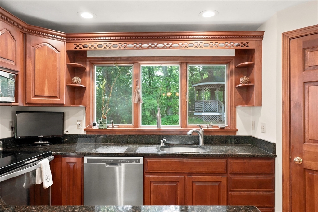 11 Marlboro Road Georgetown, MA 01833 - Photo 10 of 42 a kitchen with granite countertop a sink and a window