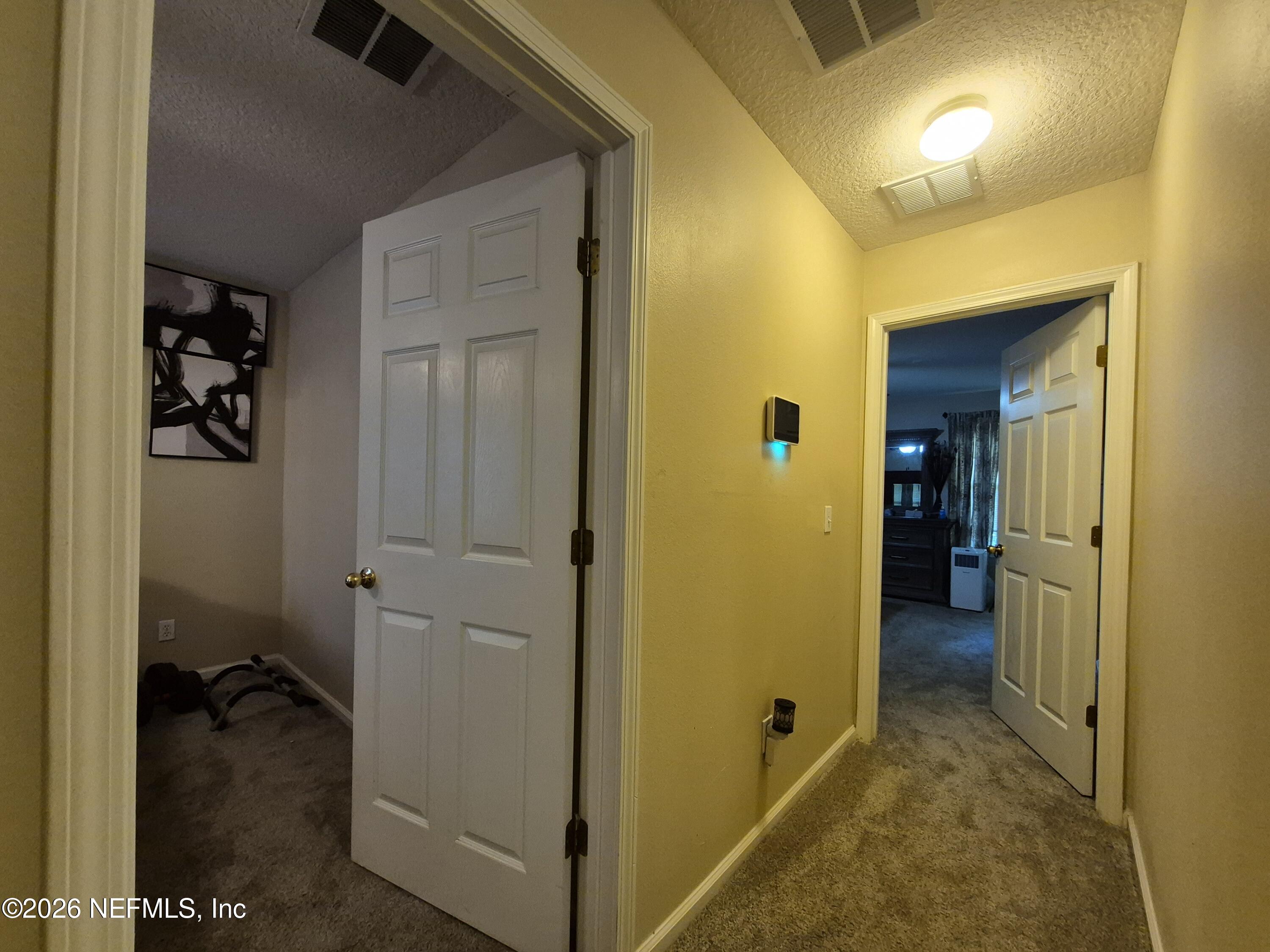7939 Melvin Road Jacksonville, FL 32210 - Photo 17 of 36 Hallway to Bedrooms