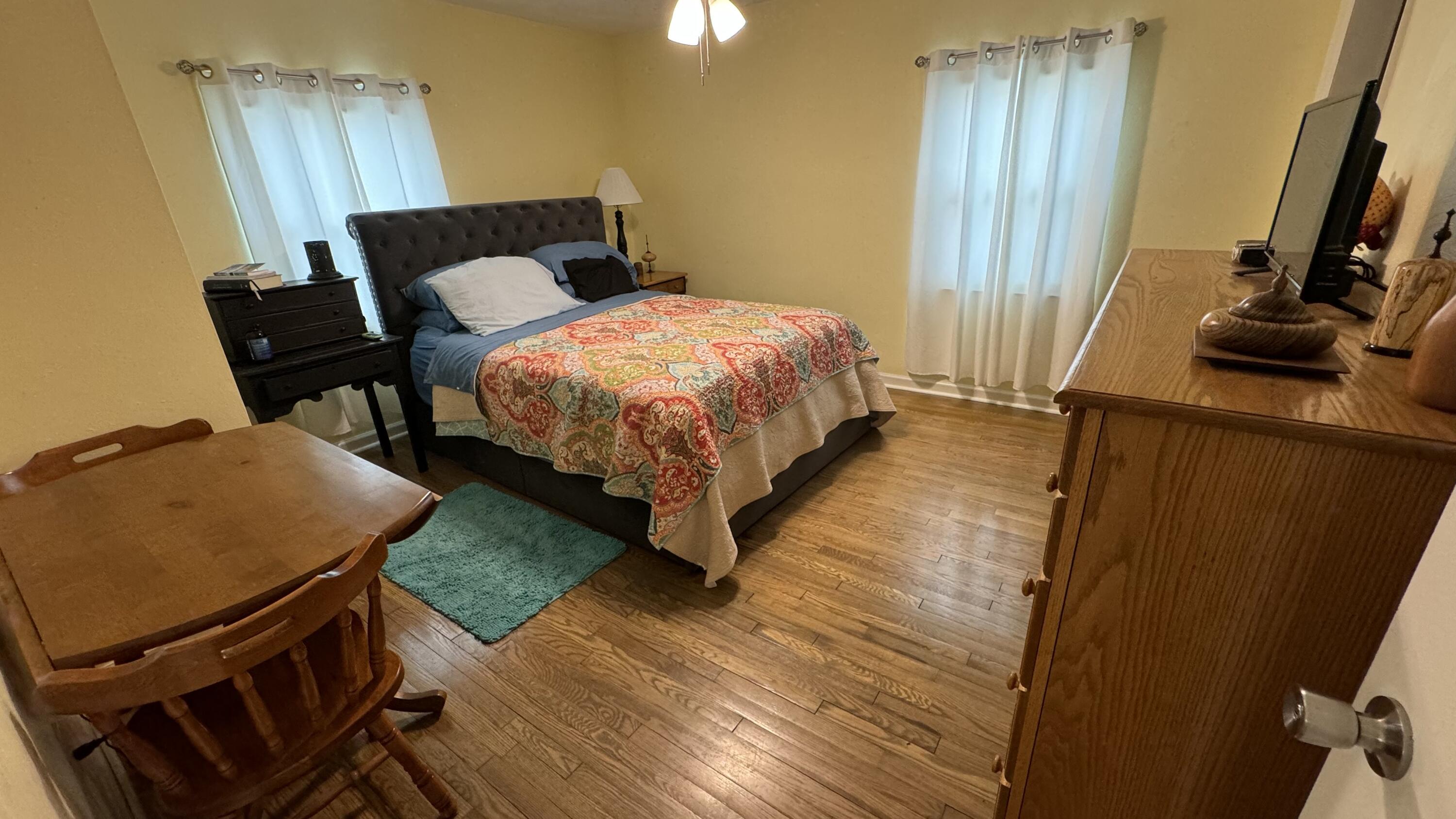 1902 Burma Road Salem, VA 24153 - Photo 10 of 17 a bedroom with a bed and a flat tv screen on a dresser