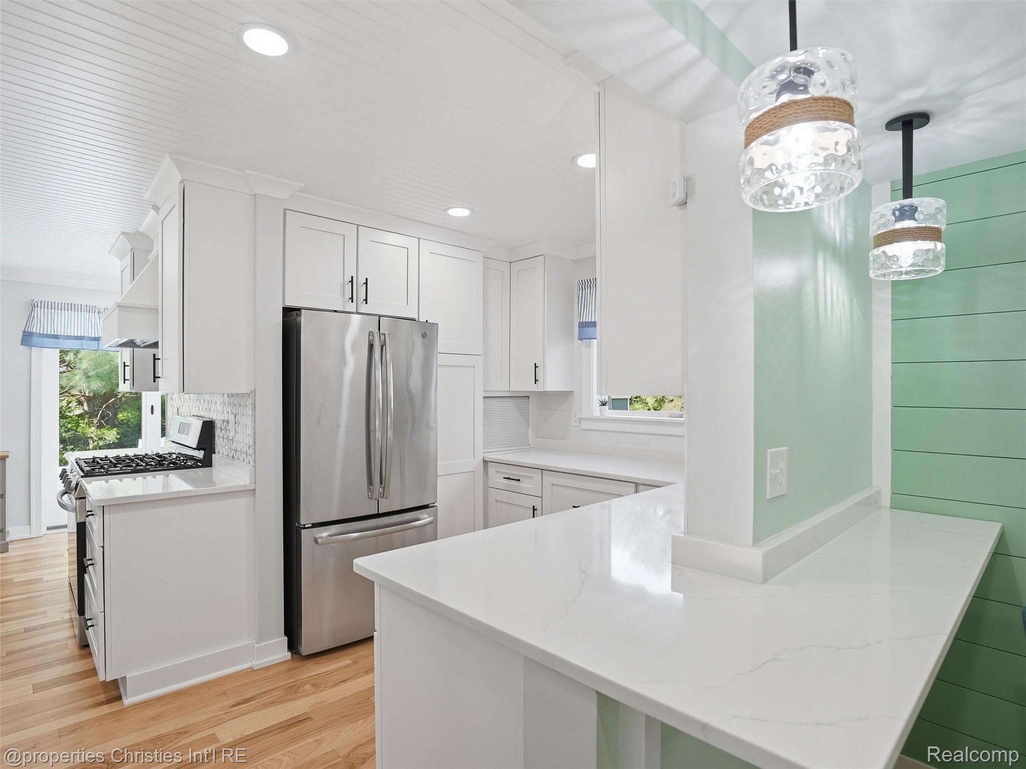 8645 Toma Road Pinckney, MI 48169 - Photo 13 of 65 Newly renovated kitchen with stainless gas range and refrigerator