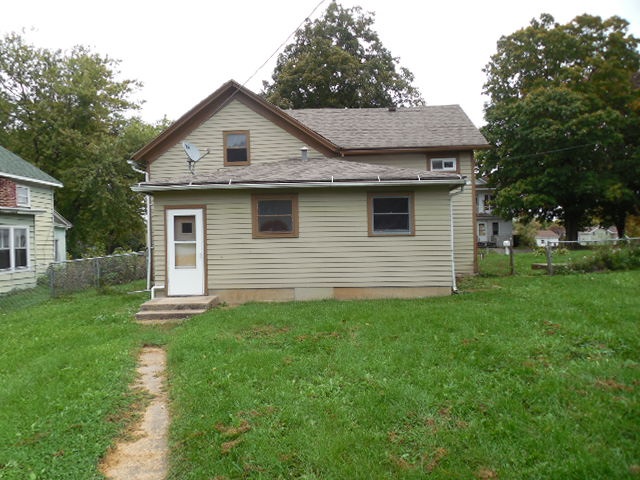 206 Adams Street Ridott, IL 61067 - Photo 8 of 8 a front view of a house with yard