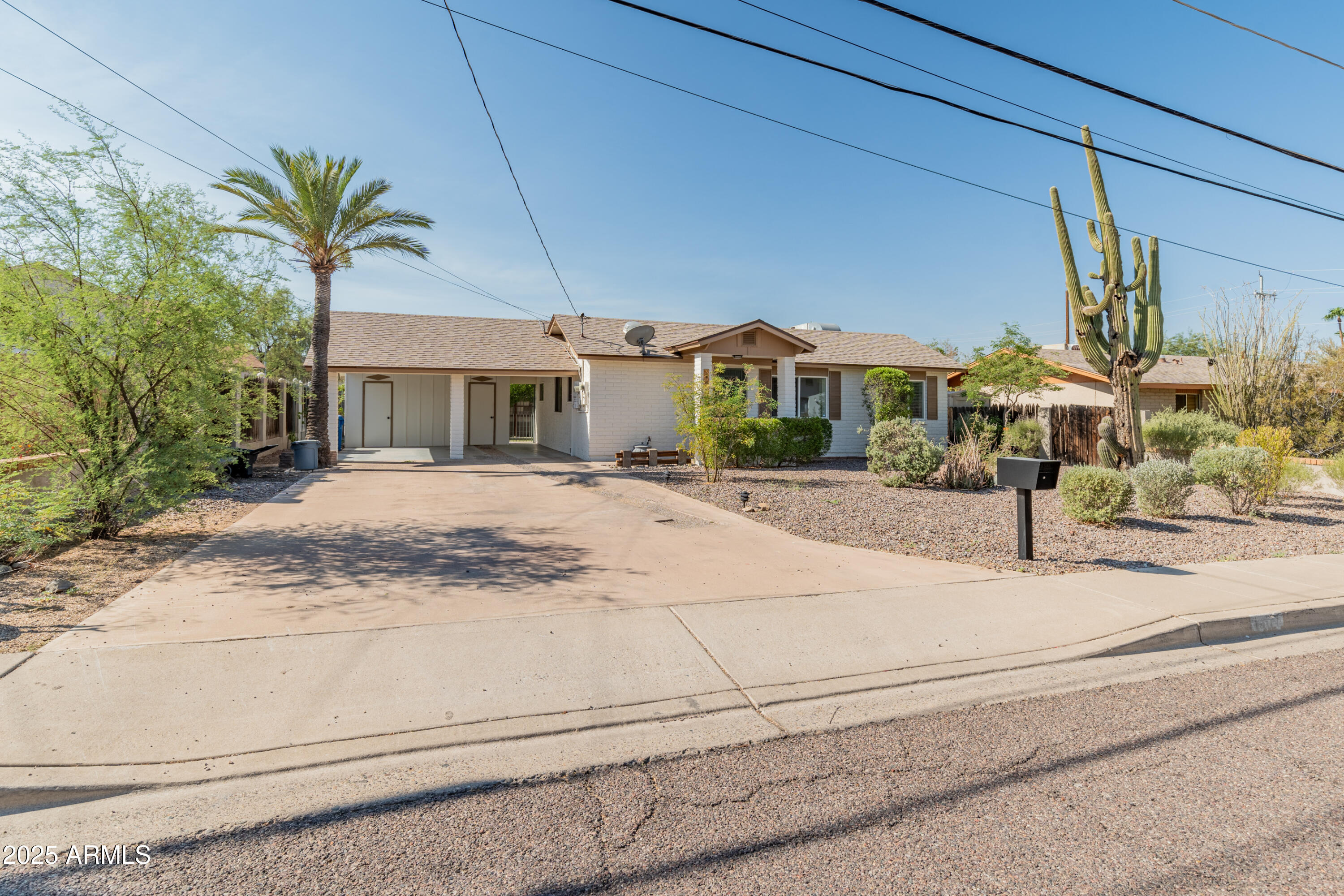 1407 East Mountain View Road Phoenix, AZ 85020 - Photo 35 of 35 a view of a house with a yard and potted plants