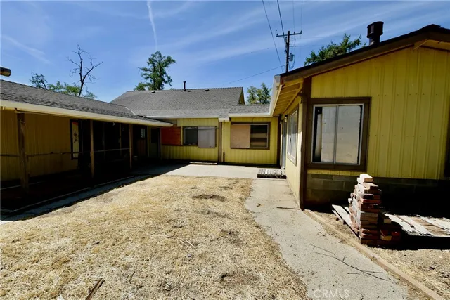 a view of a couches under an umbrella