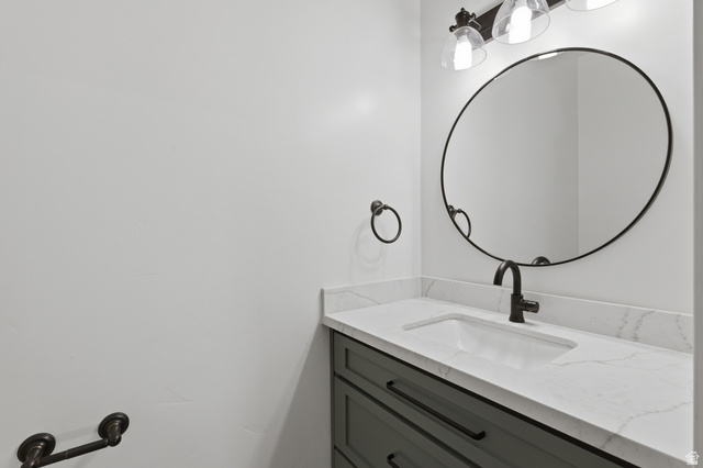 441 South 2080th Street East Springville, UT 84663 - Photo 38 of 64 Vanity featuring a quartz countertop with an integrated sink and matte black faucet