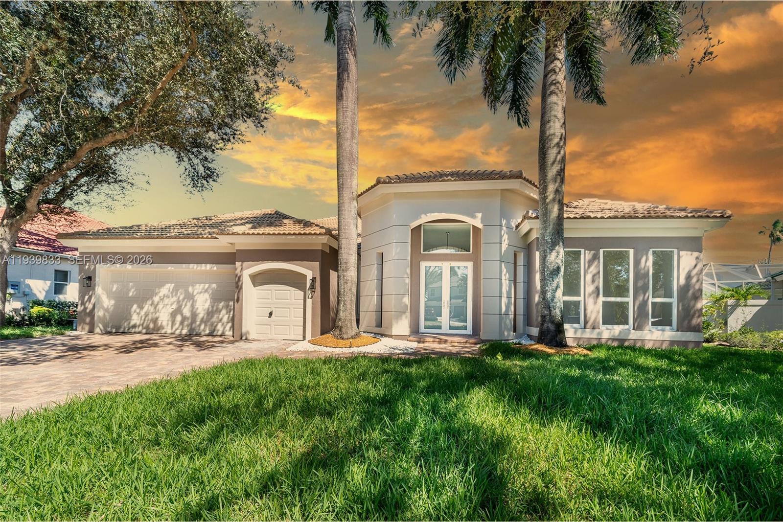 a front view of a house with porch and garden