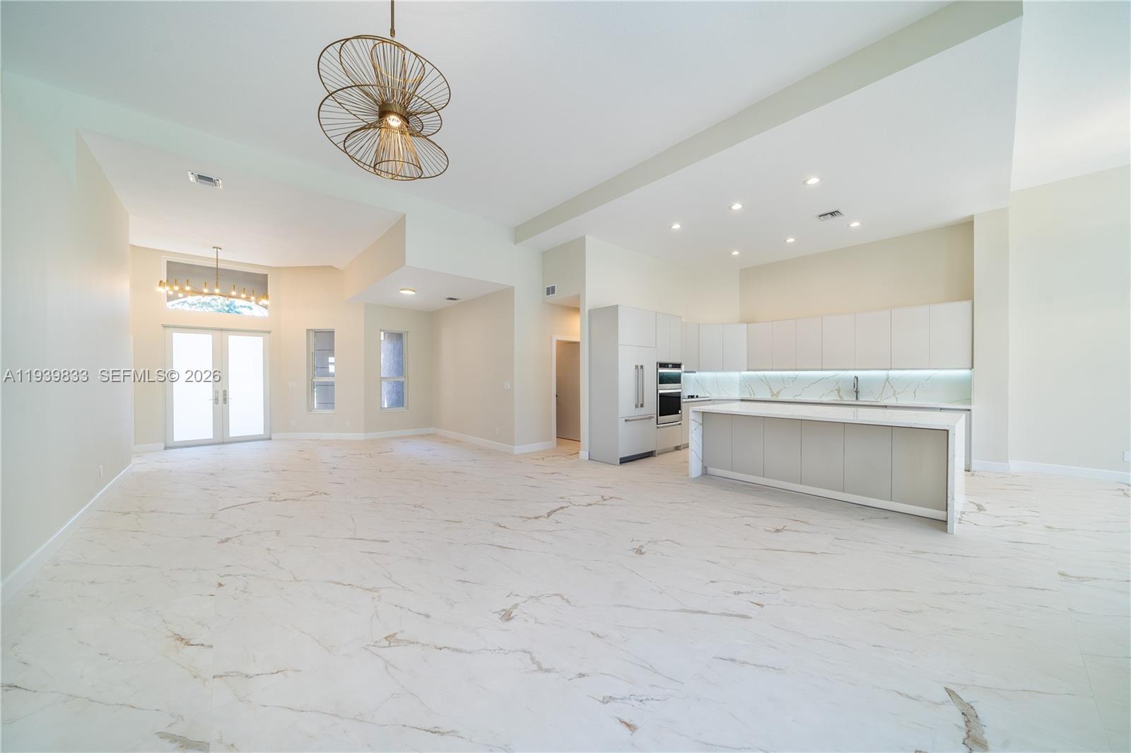 8041 Bermuda Point Lane Davie, FL 33328 - Photo 13 of 60 a view of a kitchen with a sink stainless steel appliances and cabinets