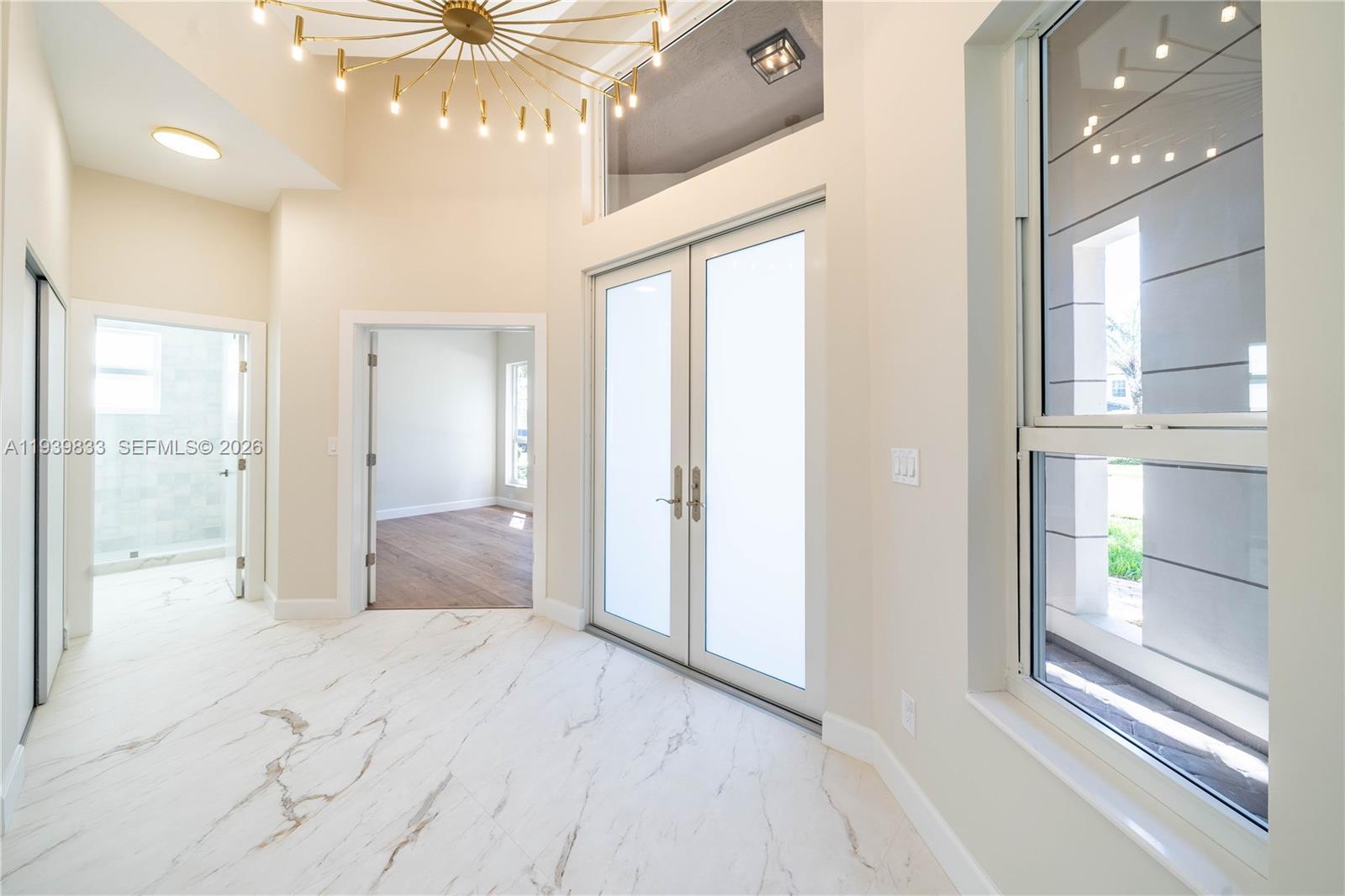 8041 Bermuda Point Lane Davie, FL 33328 - Photo 16 of 60 a view of an empty room and a window