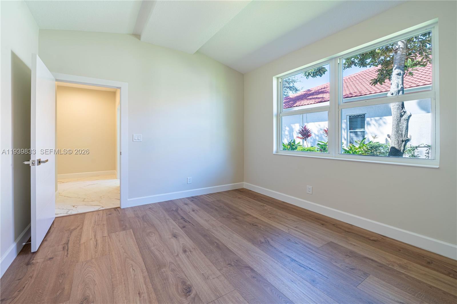 8041 Bermuda Point Lane Davie, FL 33328 - Photo 32 of 60 a view of an empty room and a window