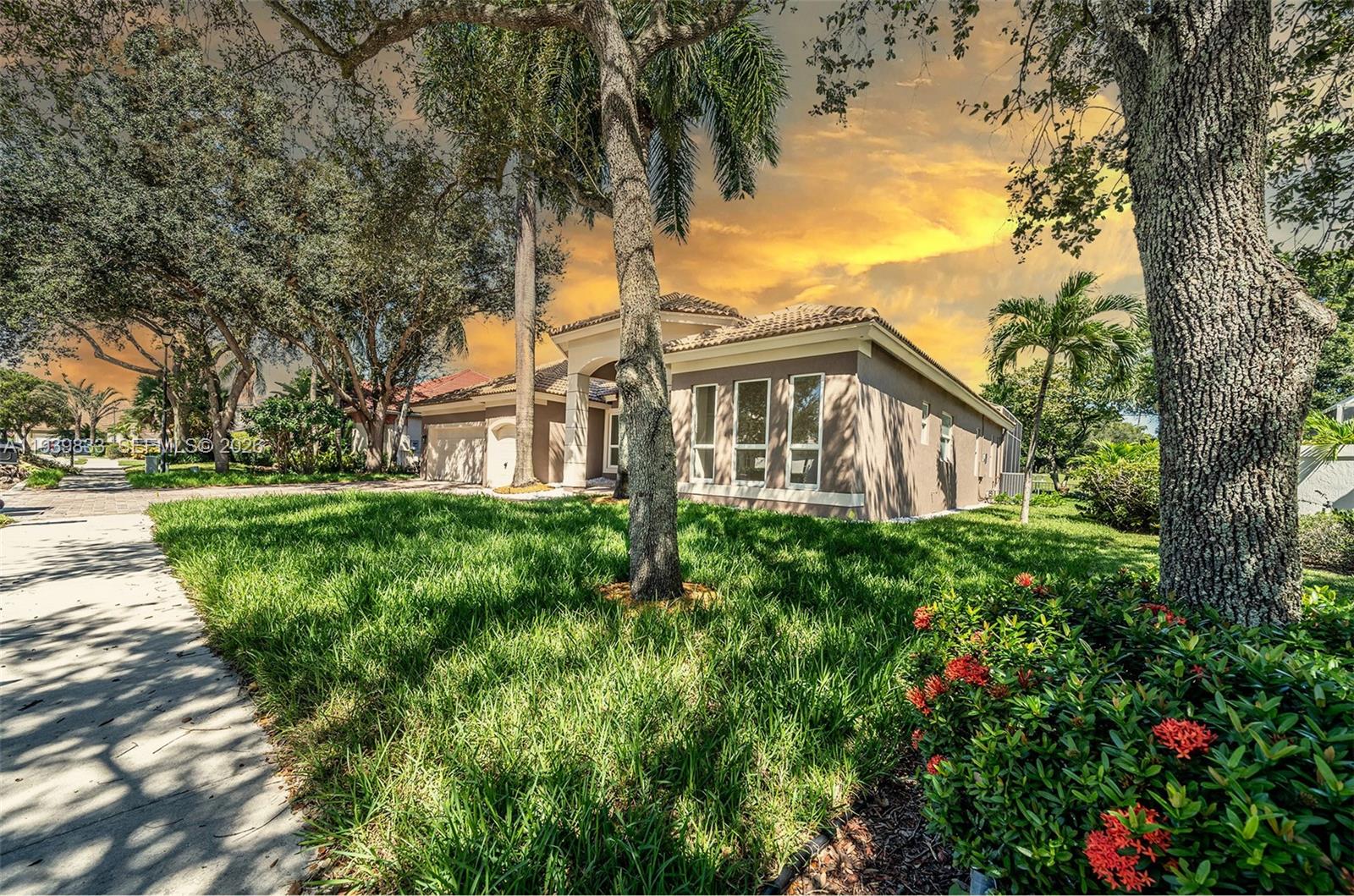 8041 Bermuda Point Lane Davie, FL 33328 - Photo 4 of 60 a view of a house with a yard