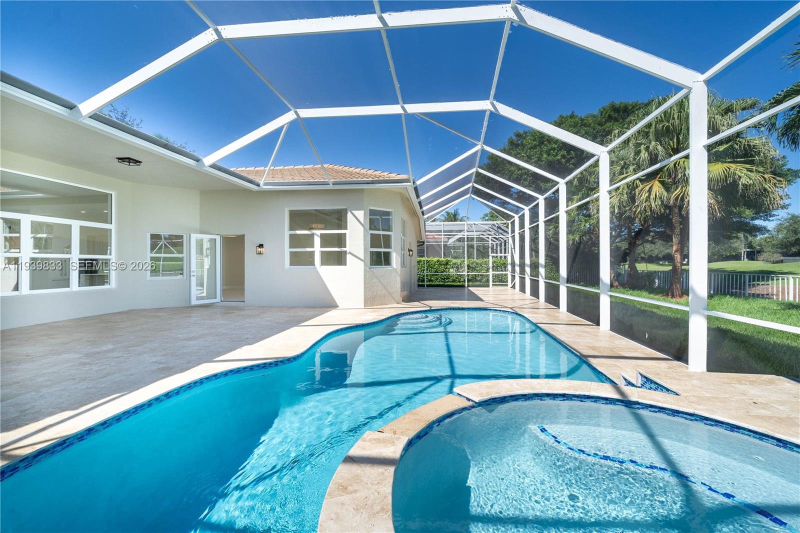 8041 Bermuda Point Lane Davie, FL 33328 - Photo 51 of 60 a house with swimming pool in front of it