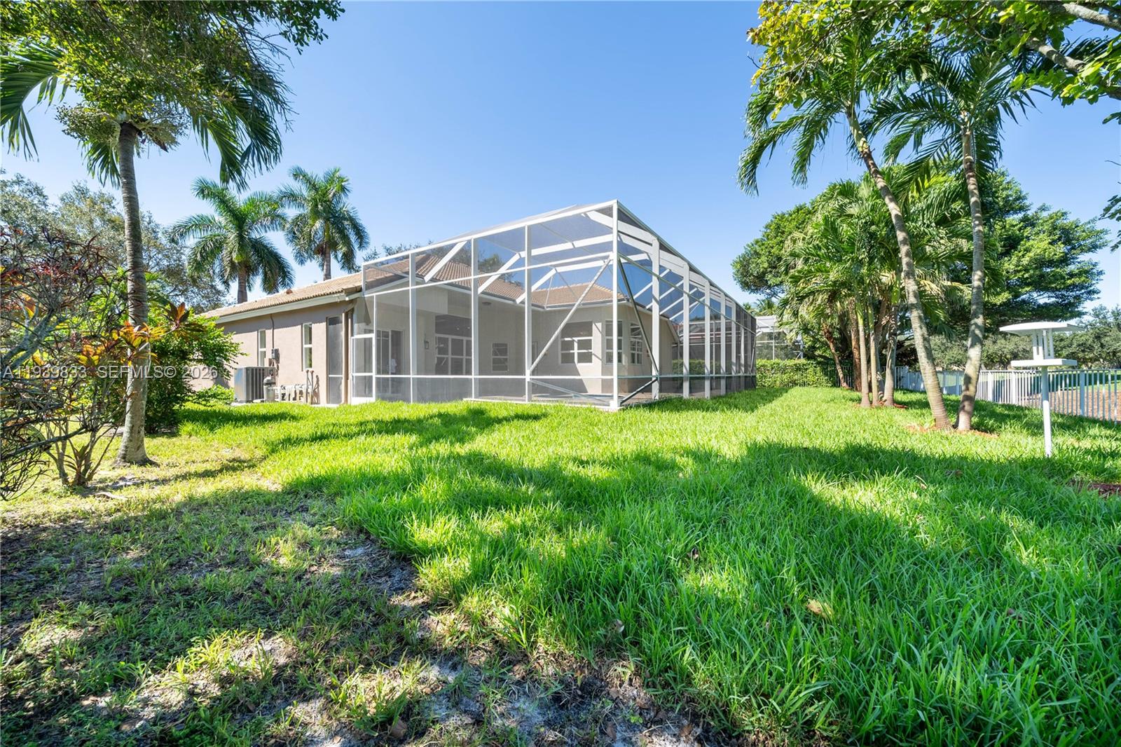 8041 Bermuda Point Lane Davie, FL 33328 - Photo 57 of 60 a view of a house with a yard and sitting area