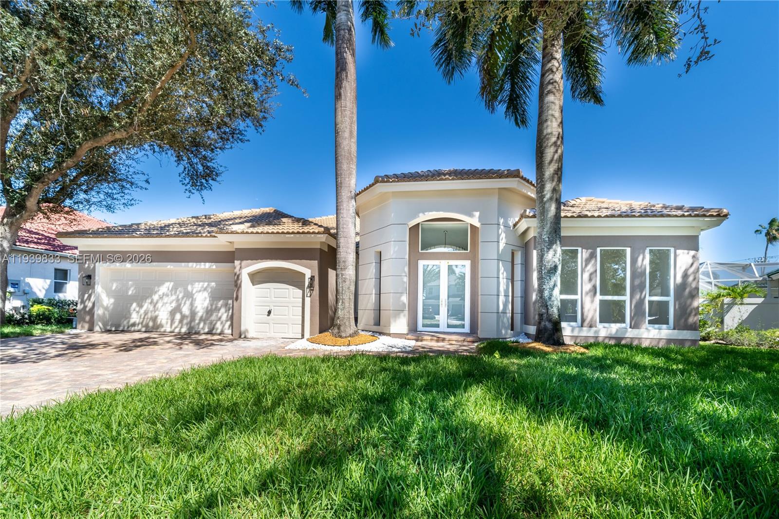 8041 Bermuda Point Lane Davie, FL 33328 - Photo 6 of 60 a front view of house with yard and green space