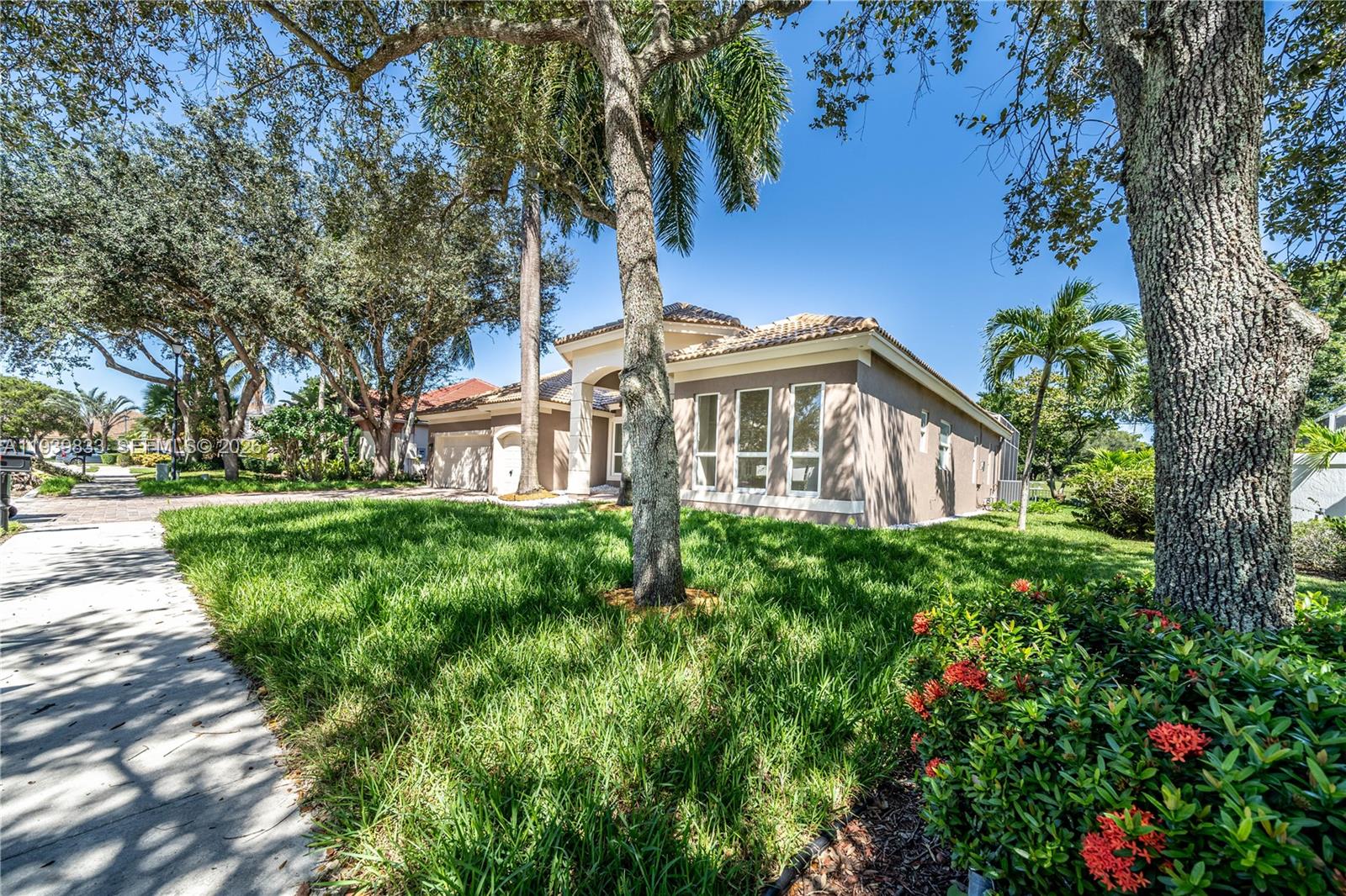 8041 Bermuda Point Lane Davie, FL 33328 - Photo 7 of 60 a view of a garden with a fountain