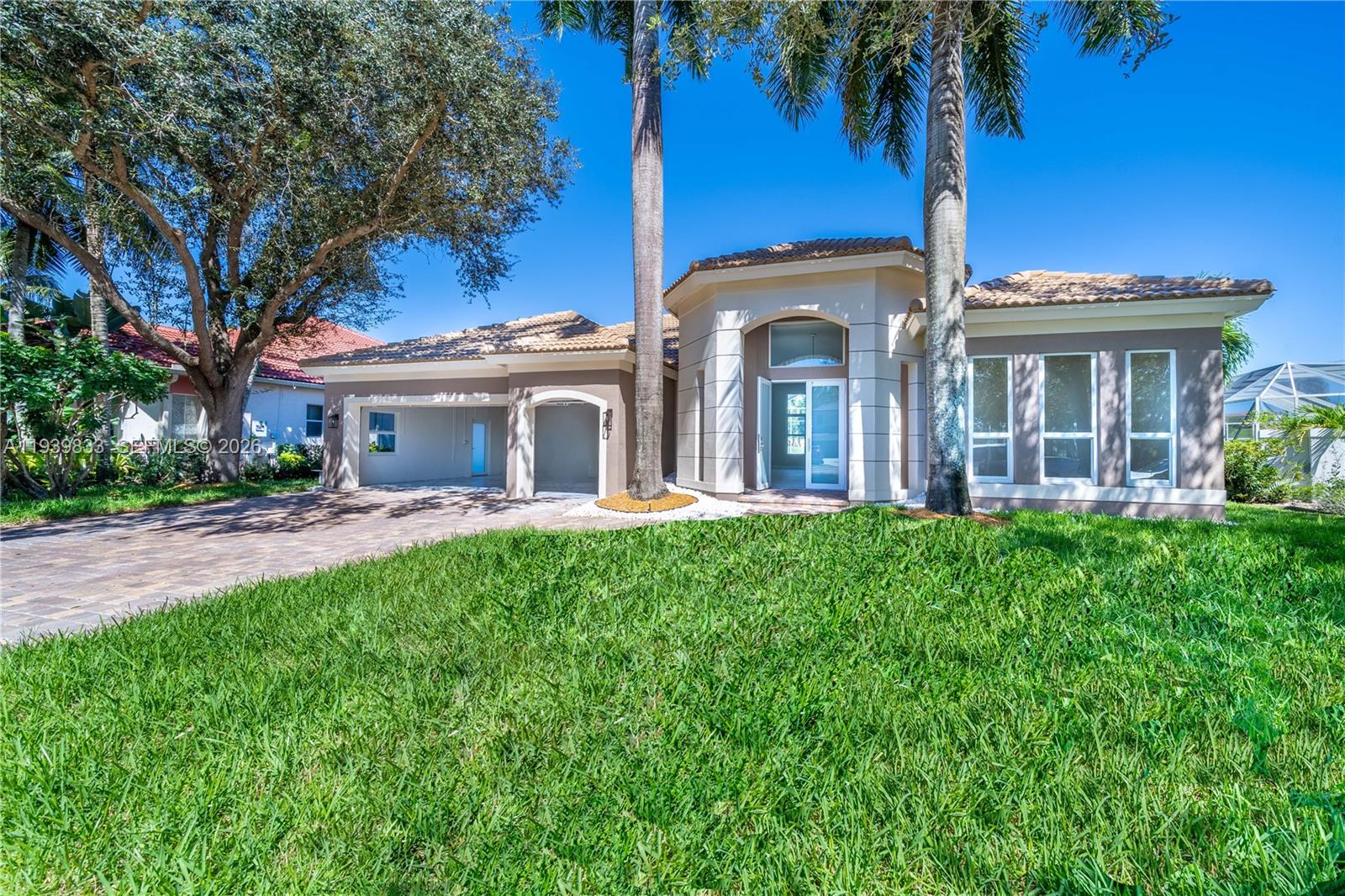 8041 Bermuda Point Lane Davie, FL 33328 - Photo 10 of 60 a view of a house with a yard and potted plants