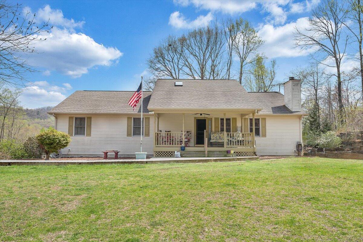 a front view of house with yard and seating area