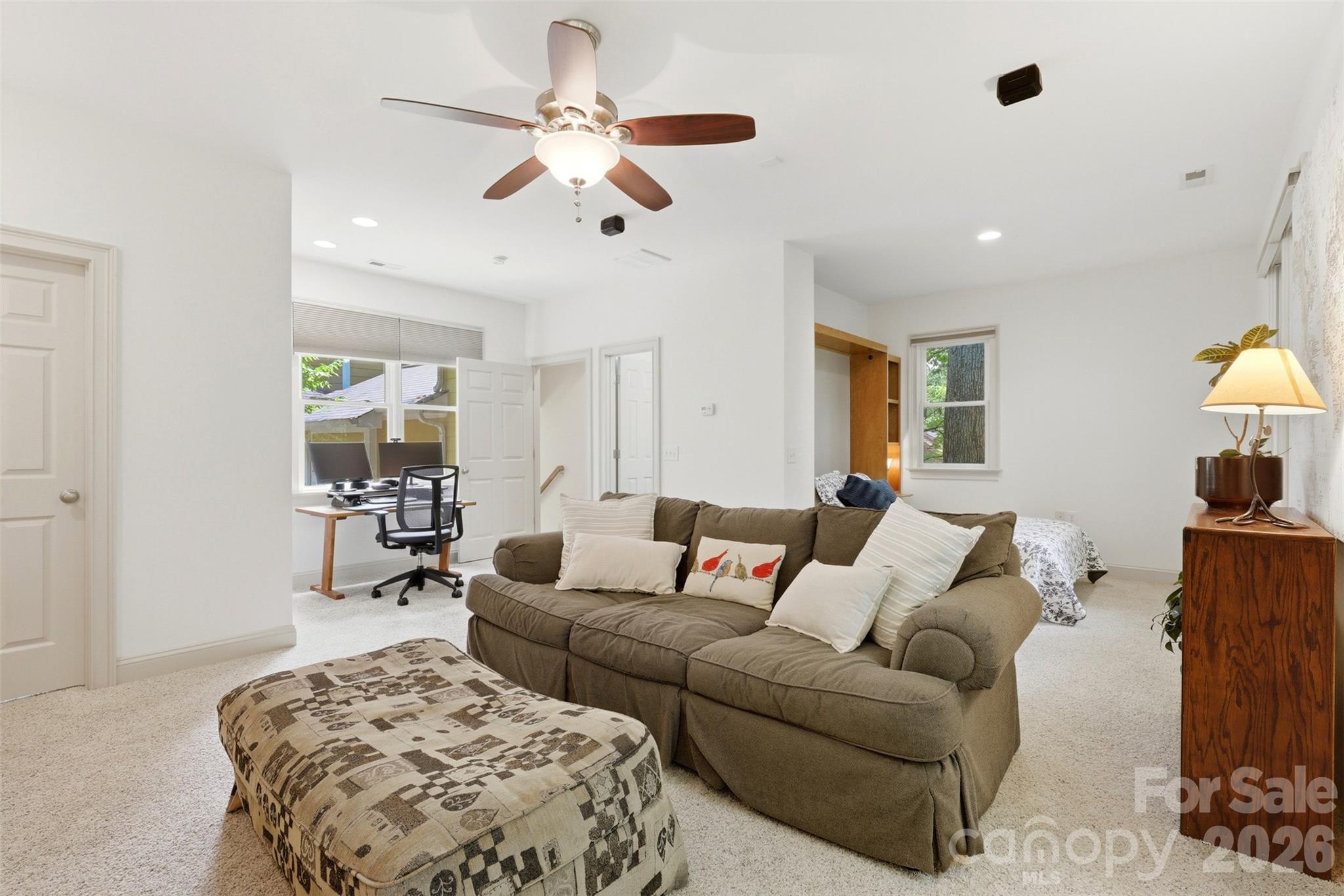 739 Julia Street Fort Mill, SC 29708 - Photo 30 of 48 a living room with furniture and a chandelier