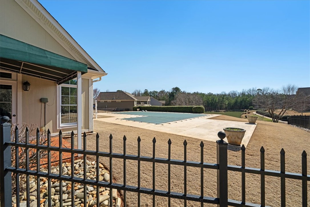 38 Angus Run Seneca, SC 29672 - Photo 3 of 46 This spacious backyard features a sparkling pool and ample patio space for outdoor enjoyment.