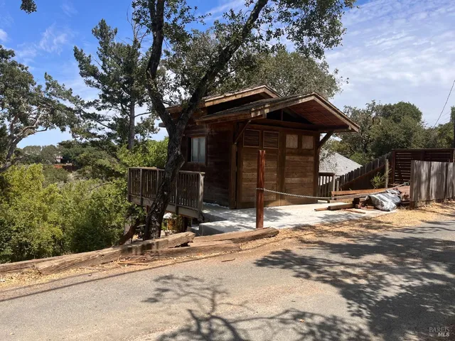 a view of a house with snow on the road