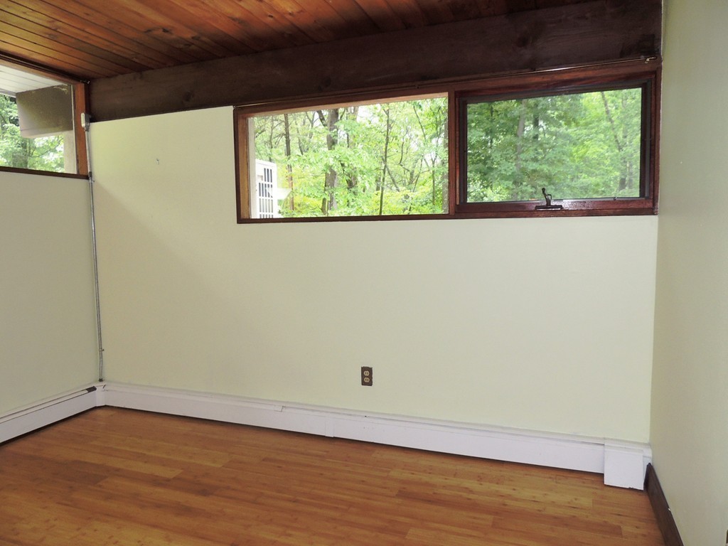 76 Wolf Rock Road Carlisle, MA 01741 - Photo 12 of 20 a view of a room that has a window in it