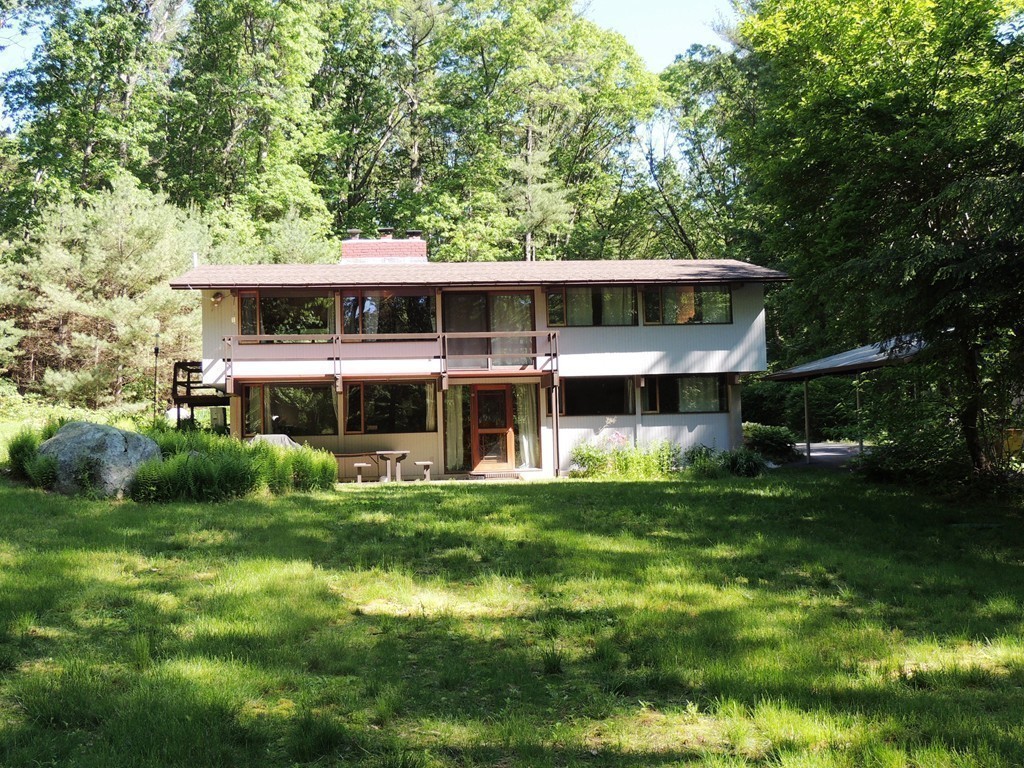 76 Wolf Rock Road Carlisle, MA 01741 - Photo 14 of 20 a front view of a house with a garden
