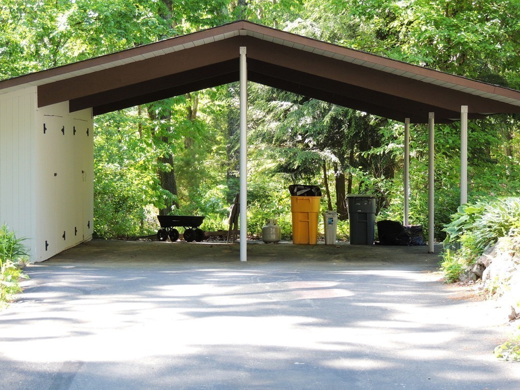 76 Wolf Rock Road Carlisle, MA 01741 - Photo 15 of 20 a front view of a house with a yard