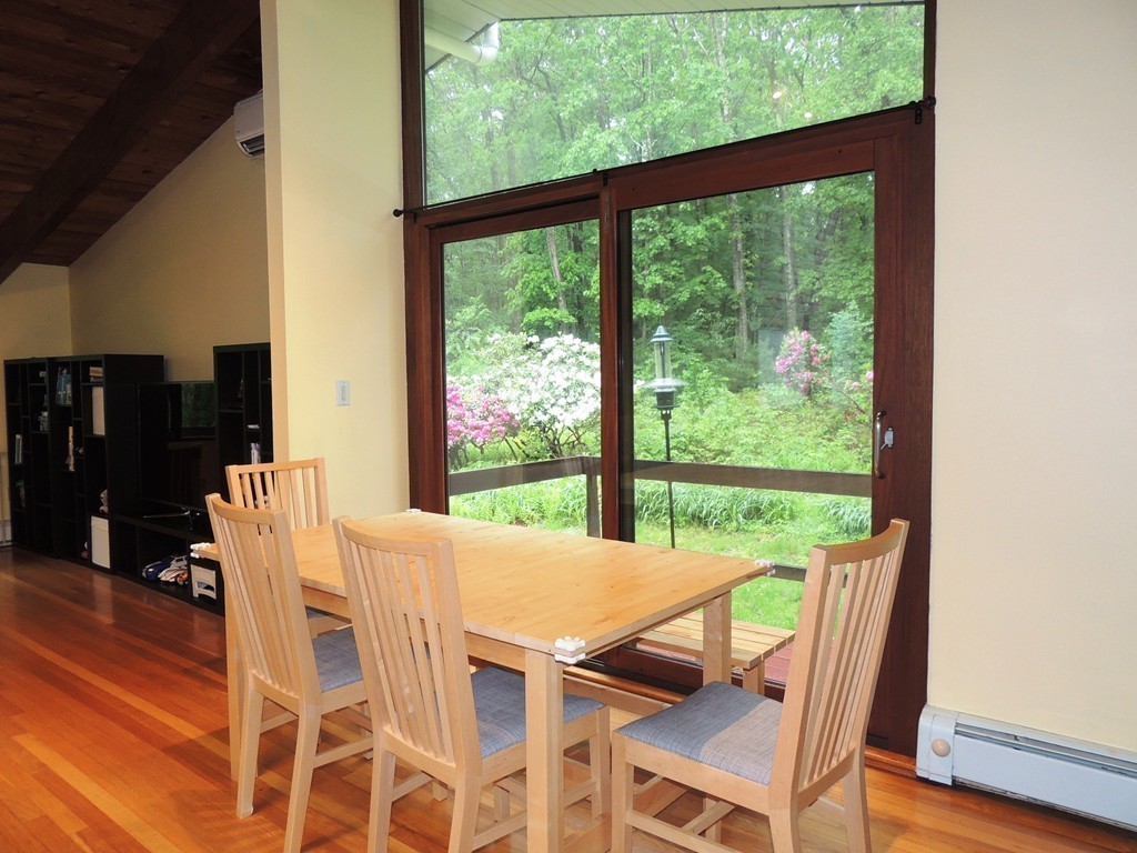 76 Wolf Rock Road Carlisle, MA 01741 - Photo 6 of 20 a view of a dining room with furniture window and outside view