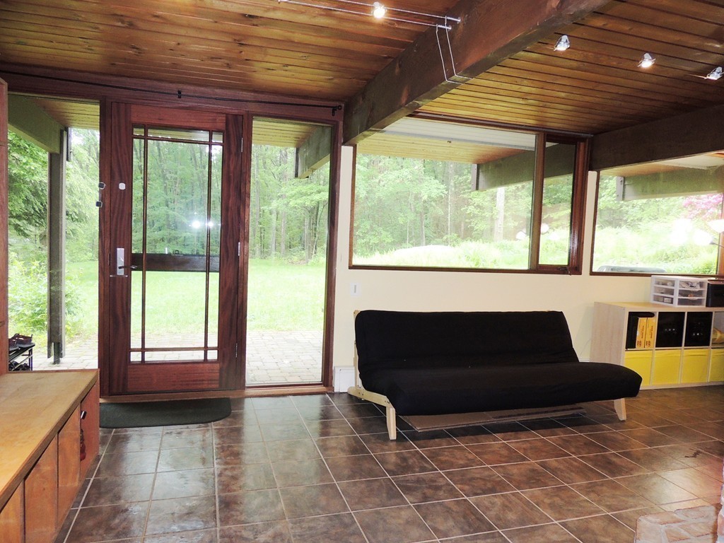 76 Wolf Rock Road Carlisle, MA 01741 - Photo 7 of 20 a living room with furniture and a fireplace