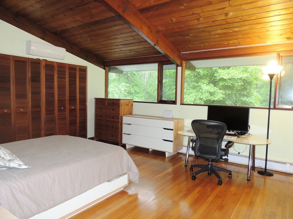 76 Wolf Rock Road Carlisle, MA 01741 - Photo 9 of 20 a bedroom with a bed and a desk