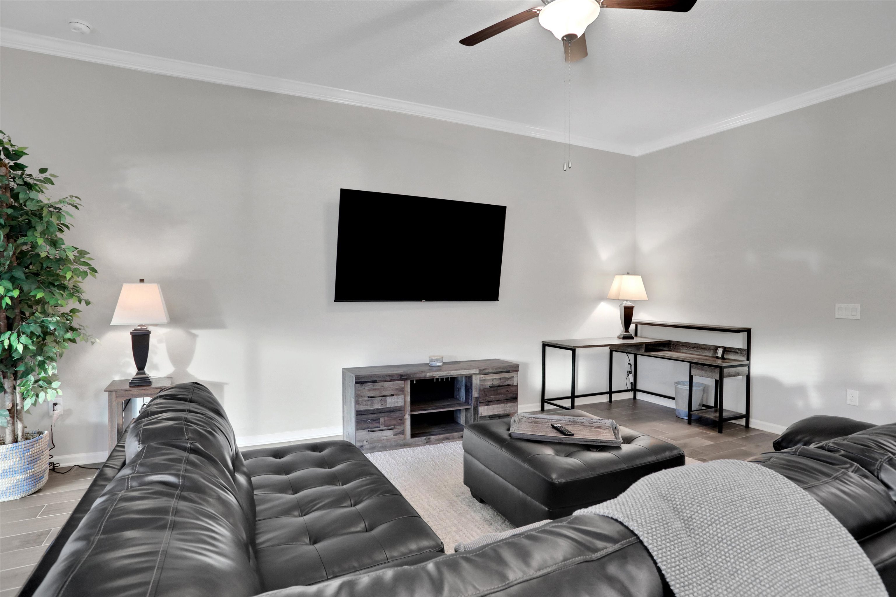 Undisclosed Address St. Augustine, FL 32095 - Photo 14 of 51 a living room with furniture and a flat screen tv