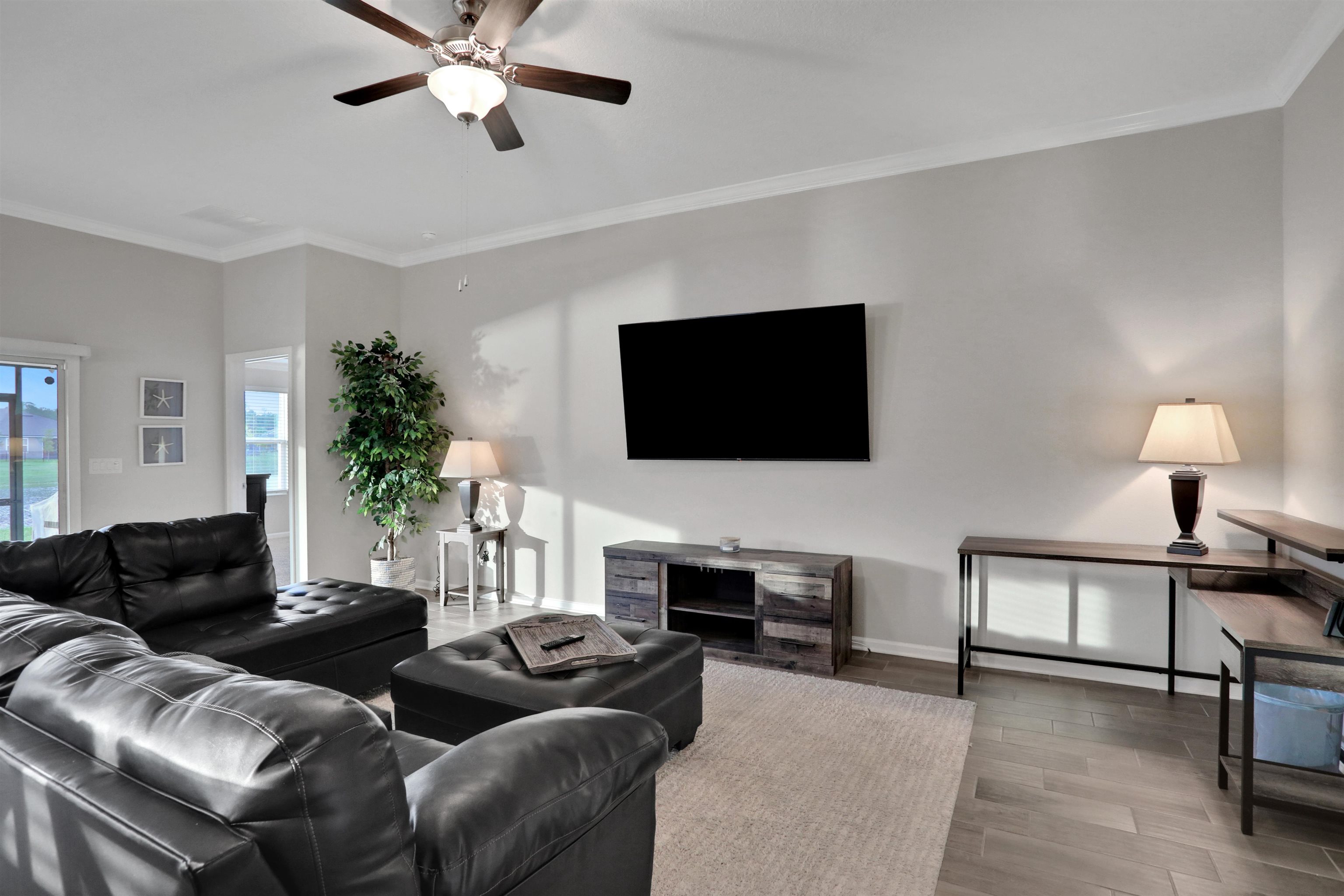 Undisclosed Address St. Augustine, FL 32095 - Photo 20 of 51 a living room with furniture and a flat screen tv
