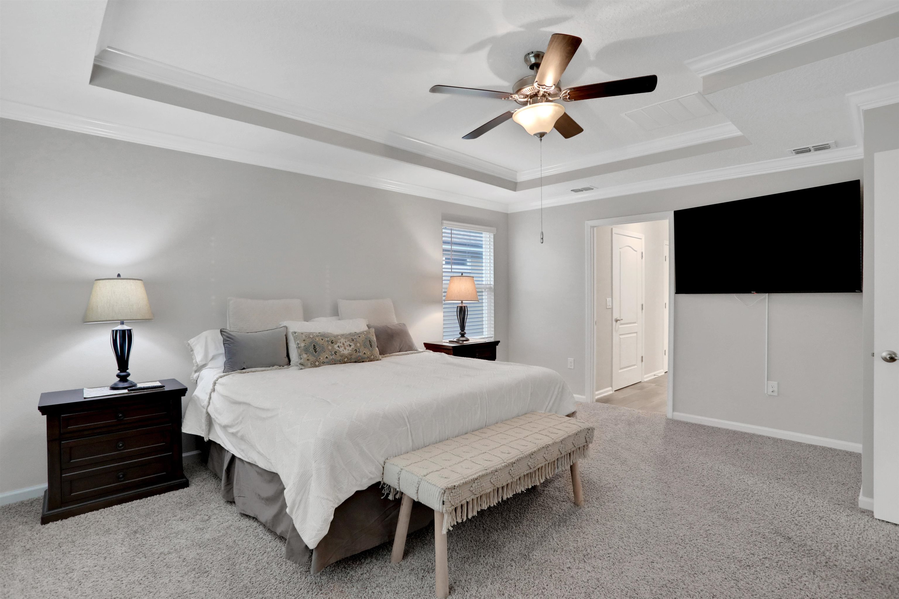 Undisclosed Address St. Augustine, FL 32095 - Photo 26 of 51 a bedroom with a bed and a flat tv screen on a dresser