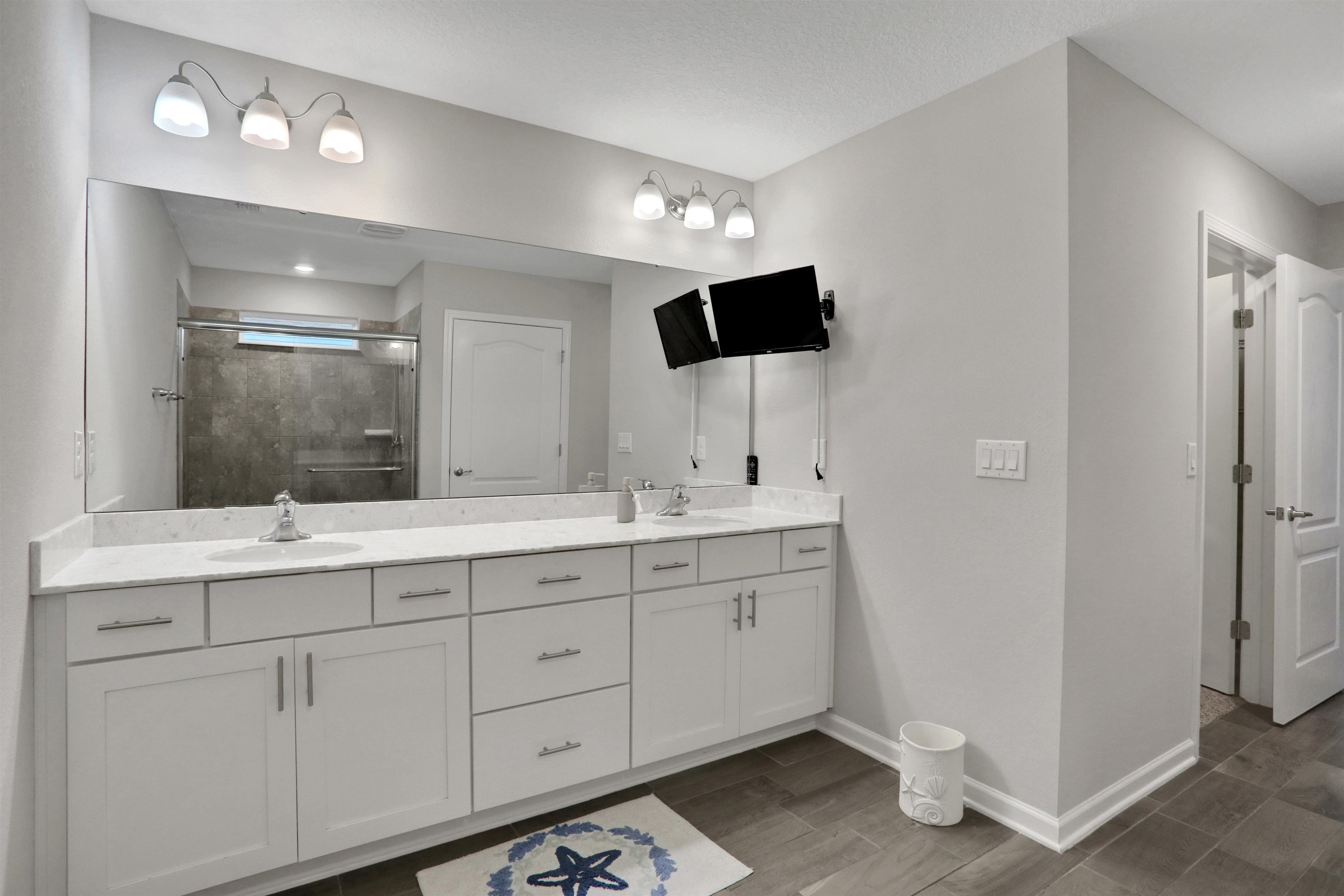 Undisclosed Address St. Augustine, FL 32095 - Photo 34 of 51 a spacious bathroom with a double vanity sink and a mirror