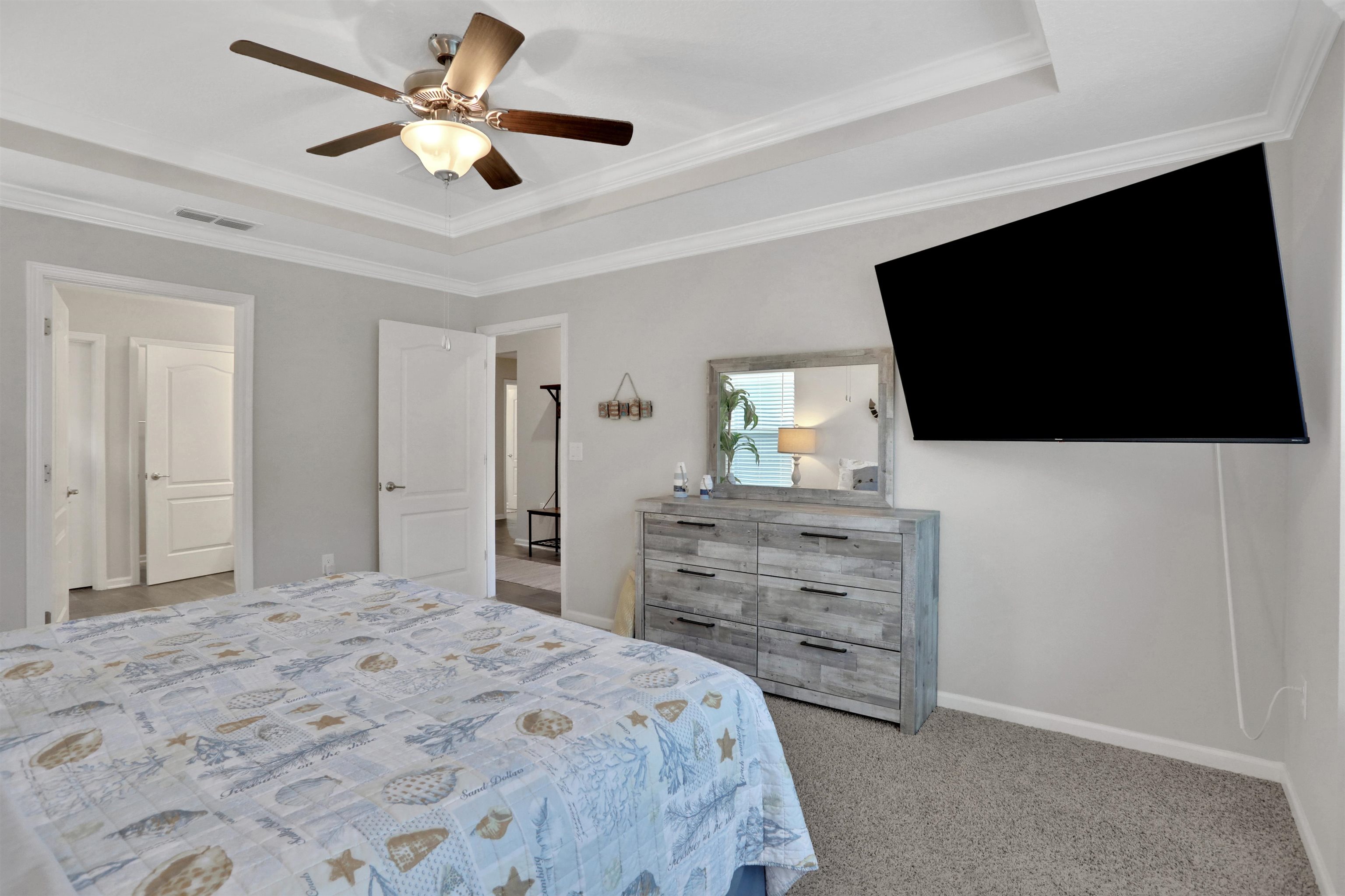 Undisclosed Address St. Augustine, FL 32095 - Photo 4 of 51 a bedroom with a bed a flat screen tv and a dresser