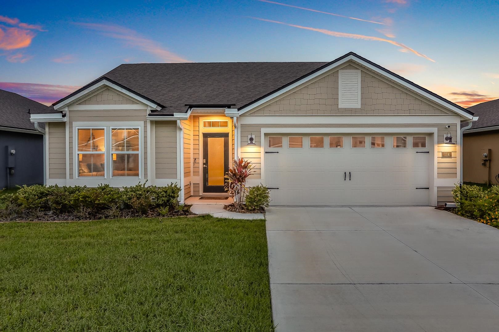 Undisclosed Address St. Augustine, FL 32095 - Photo 40 of 51 a front view of a house with a yard and garage