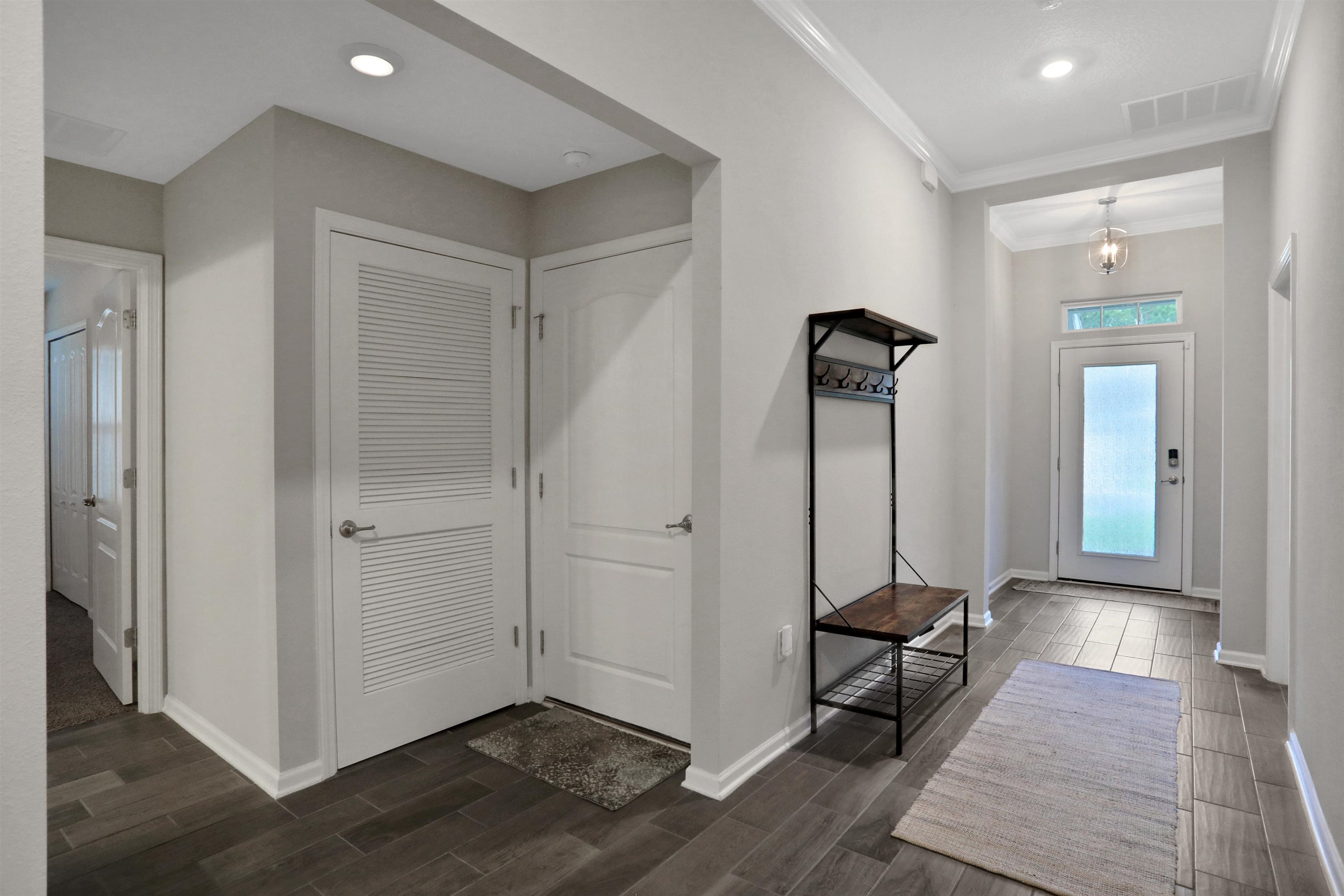 Undisclosed Address St. Augustine, FL 32095 - Photo 48 of 51 a view of a hallway with entryway wooden floor and front door