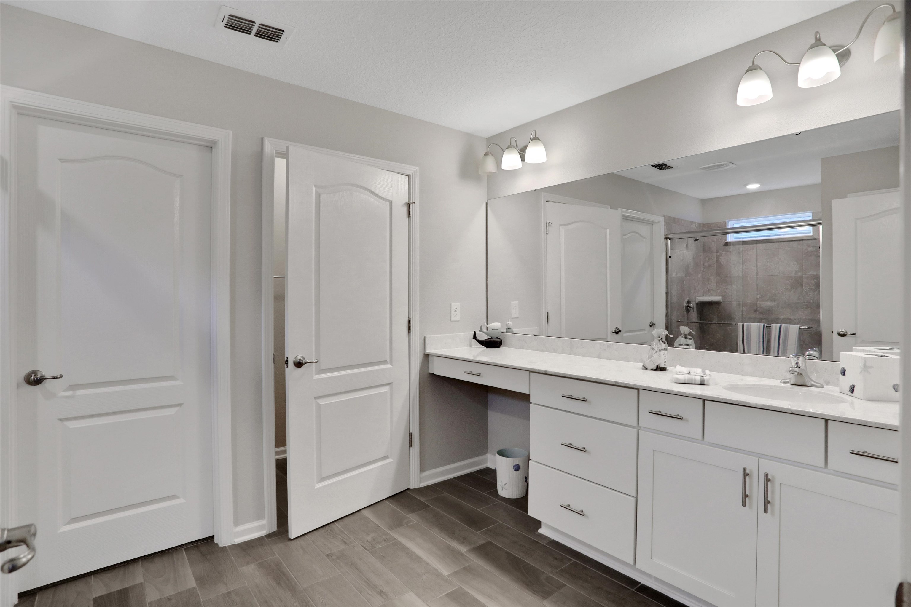 Undisclosed Address St. Augustine, FL 32095 - Photo 5 of 51 a bathroom with a double vanity sink mirror and