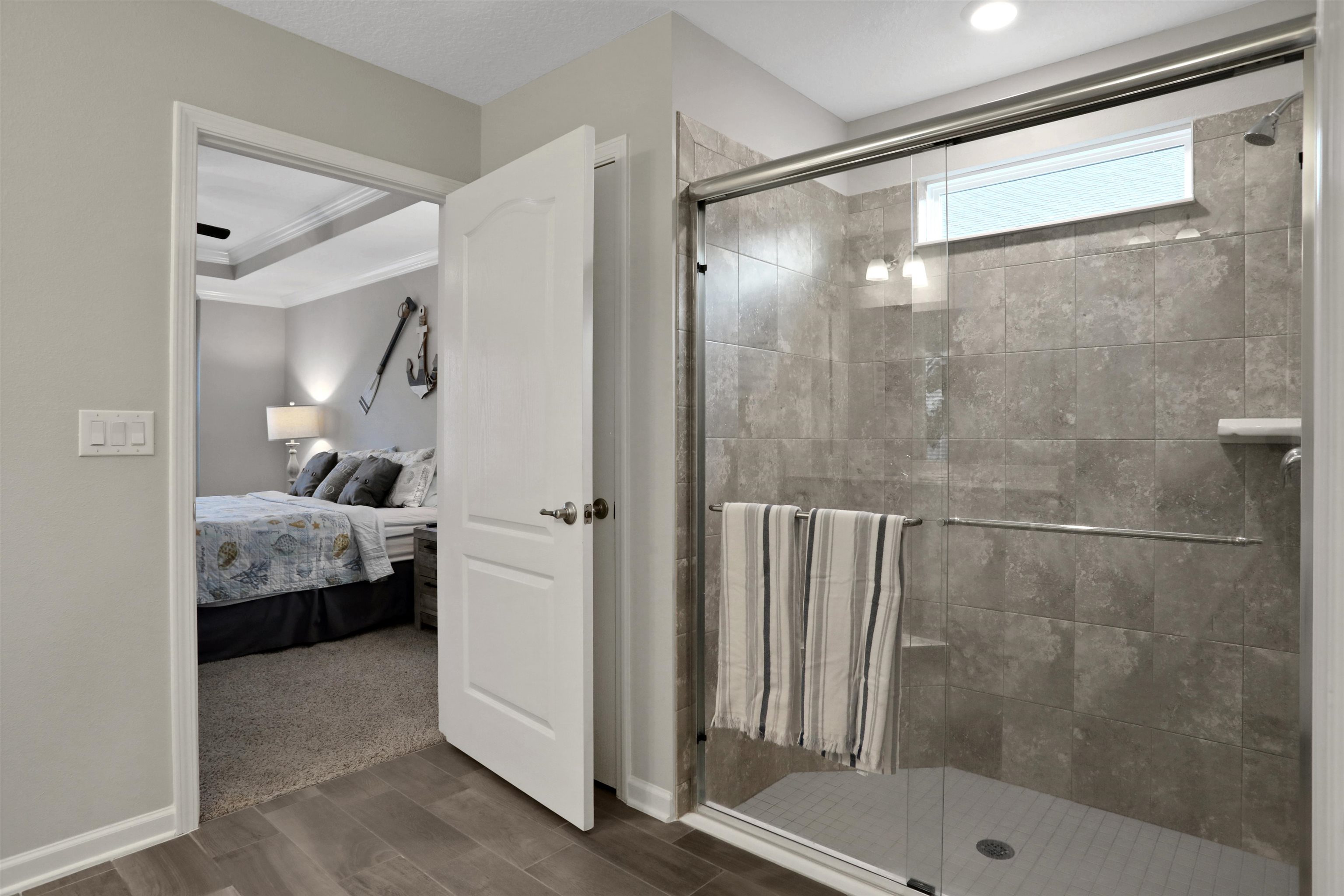 Undisclosed Address St. Augustine, FL 32095 - Photo 8 of 51 a room that has a glass door and shower