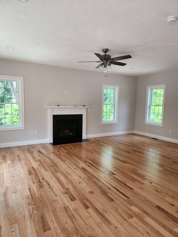 81 Purgatory Road Sutton, MA 01590 - Photo 11 of 35 an empty room with windows and fireplace