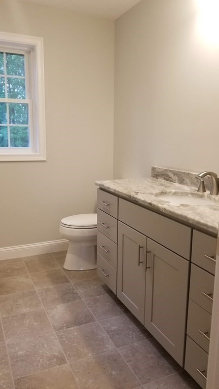 81 Purgatory Road Sutton, MA 01590 - Photo 14 of 35 a bathroom with a granite countertop toilet and sink