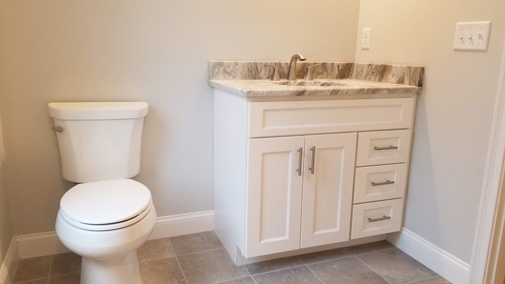 81 Purgatory Road Sutton, MA 01590 - Photo 16 of 35 a bathroom with a toilet a sink and mirror