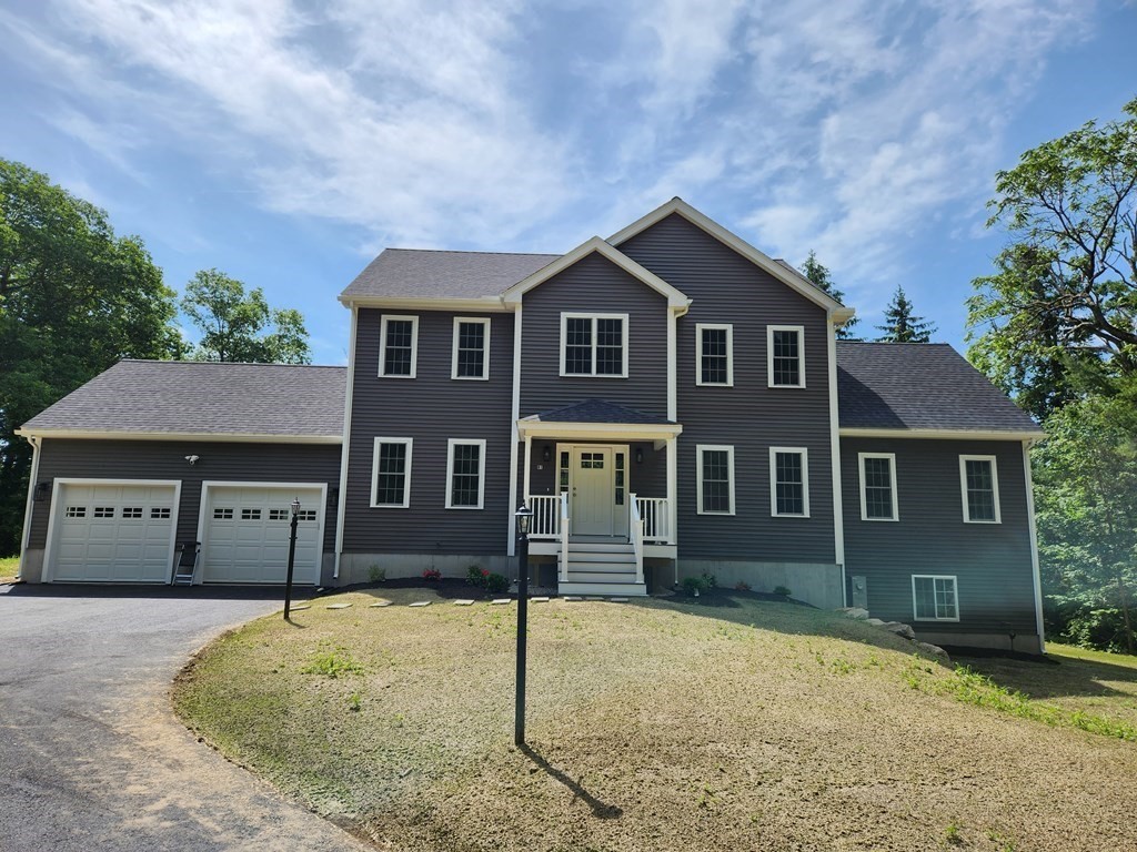 81 Purgatory Road Sutton, MA 01590 - Photo 2 of 35 front view of a house with a yard