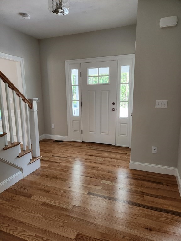 81 Purgatory Road Sutton, MA 01590 - Photo 22 of 35 an empty room with wooden floor and windows