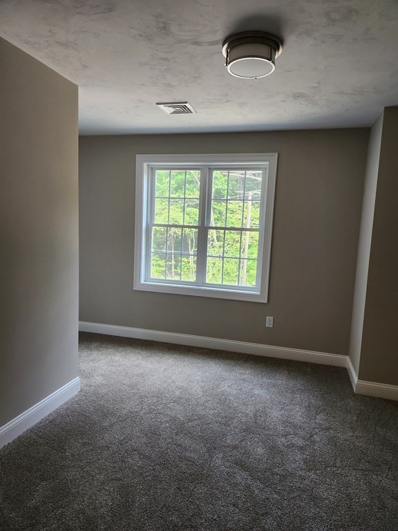 81 Purgatory Road Sutton, MA 01590 - Photo 27 of 35 an empty room with a window