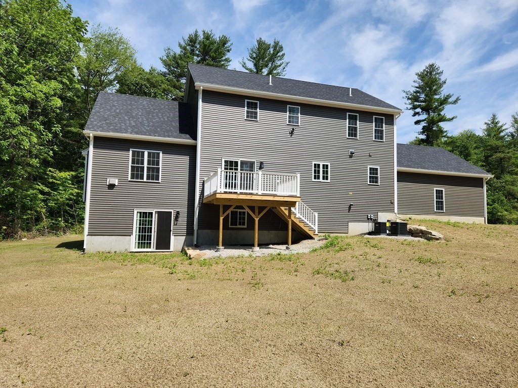 81 Purgatory Road Sutton, MA 01590 - Photo 3 of 35 a house that has a large tree in front of it