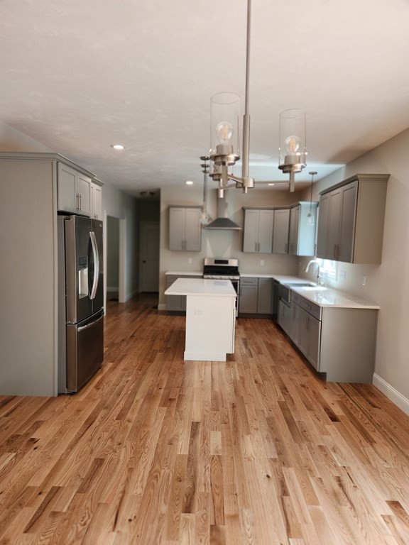 81 Purgatory Road Sutton, MA 01590 - Photo 4 of 35 a kitchen with stainless steel appliances a stove top oven and cabinets