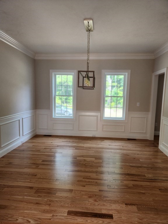 81 Purgatory Road Sutton, MA 01590 - Photo 10 of 35 an empty room with wooden floor windows and ceiling fan